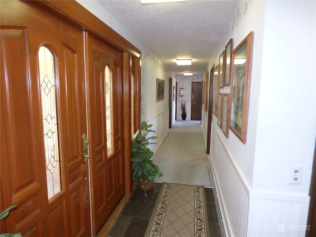 interior space with a textured ceiling