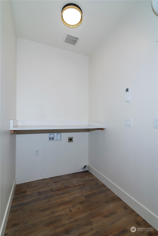 clothes washing area with hookup for an electric dryer, dark hardwood / wood-style flooring, and hookup for a washing machine