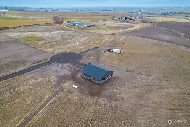 birds eye view of property featuring a rural view