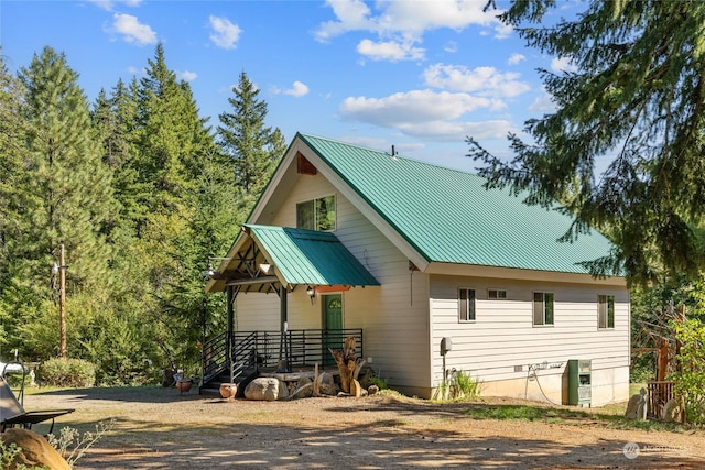 exterior space featuring metal roof