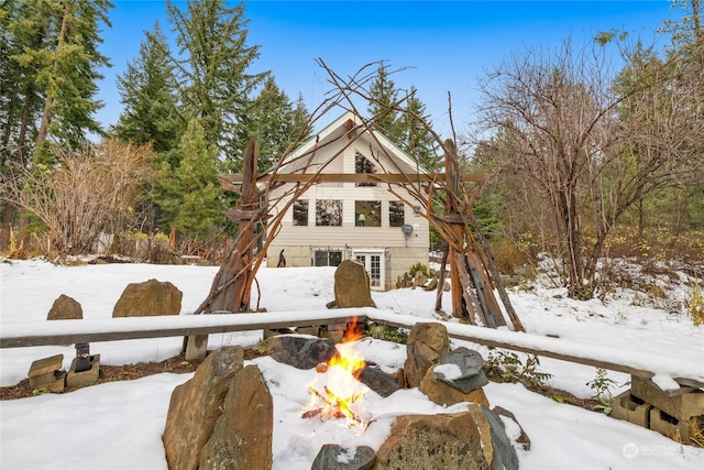 exterior space with a fire pit