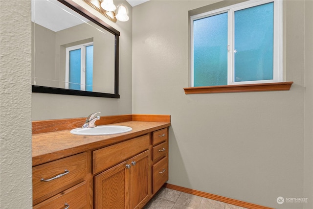 bathroom featuring vanity and baseboards