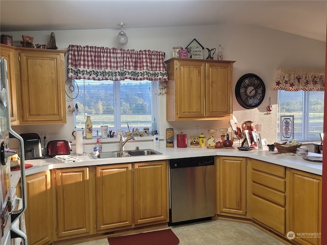 kitchen with vaulted ceiling, sink, and stainless steel dishwasher