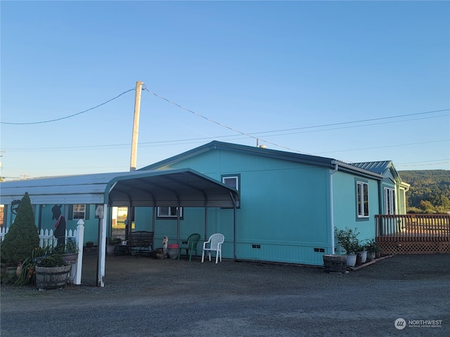 exterior space with a carport