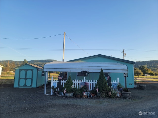 view of front of house with a shed