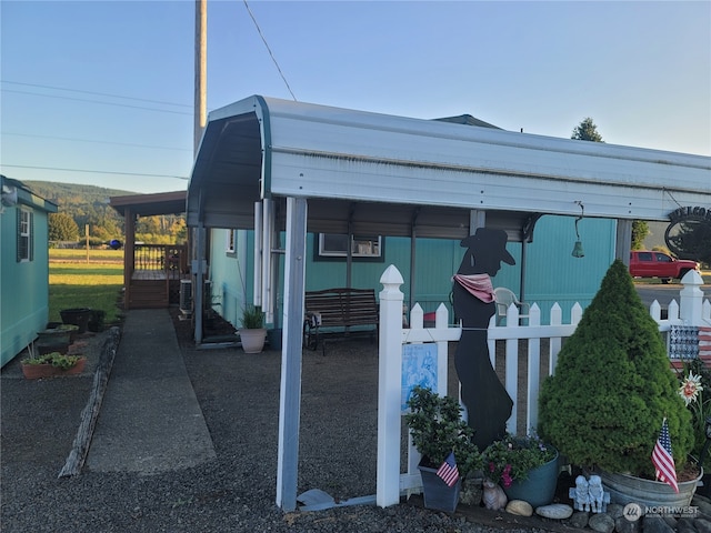 view of outbuilding with a carport