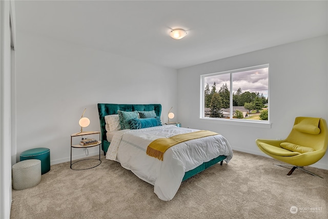 bedroom featuring light colored carpet