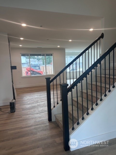 stairway featuring hardwood / wood-style flooring