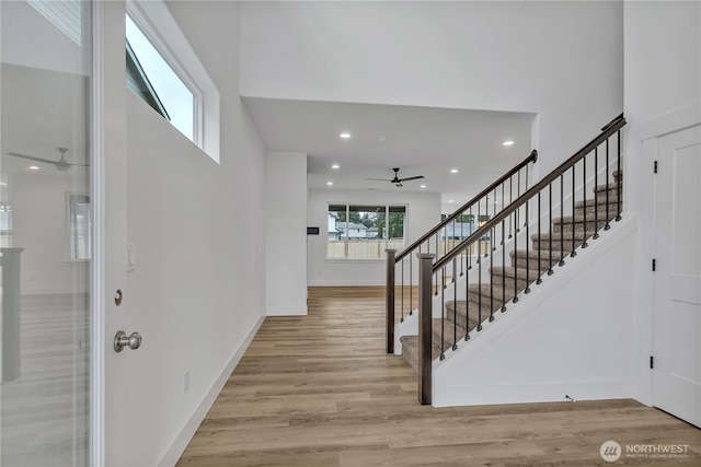 entrance foyer featuring ceiling fan and light wood-type flooring