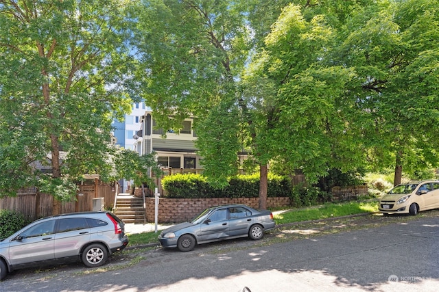 view of property hidden behind natural elements