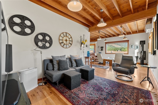 living room featuring wood ceiling, beam ceiling, a wall unit AC, and light wood-type flooring