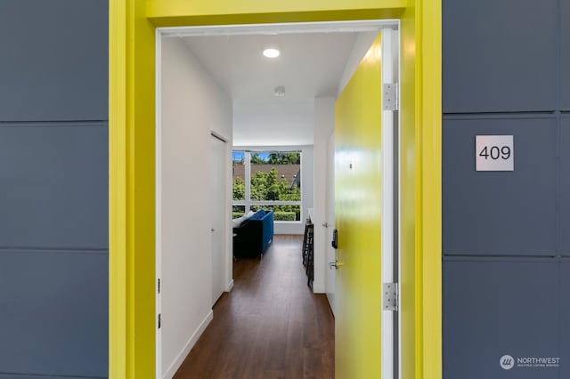 hallway with dark hardwood / wood-style floors