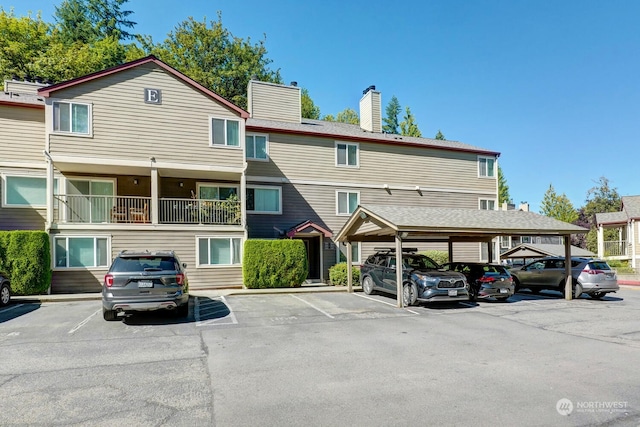 view of car parking featuring a carport