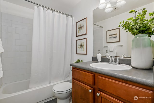 full bath with toilet, shower / bathtub combination with curtain, and vanity