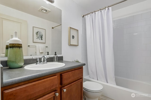 bathroom with toilet, shower / bath combination with curtain, and vanity