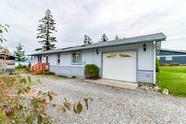 single story home featuring a garage