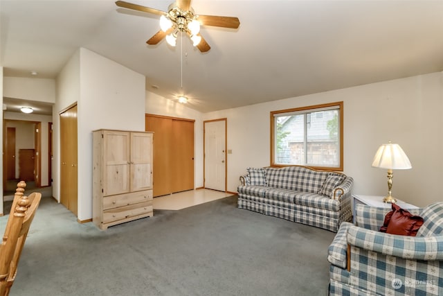 living room with light carpet, lofted ceiling, and ceiling fan