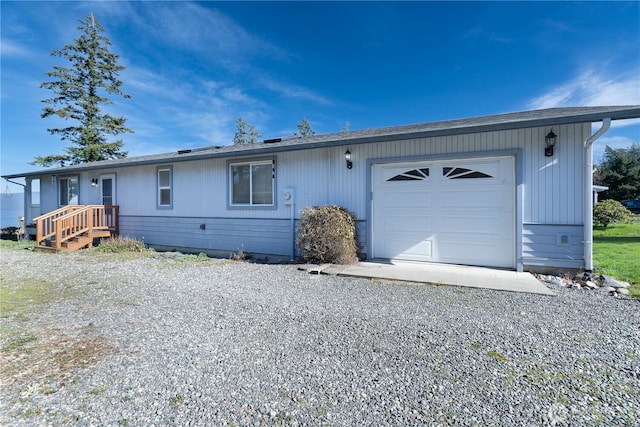 ranch-style house featuring driveway and an attached garage