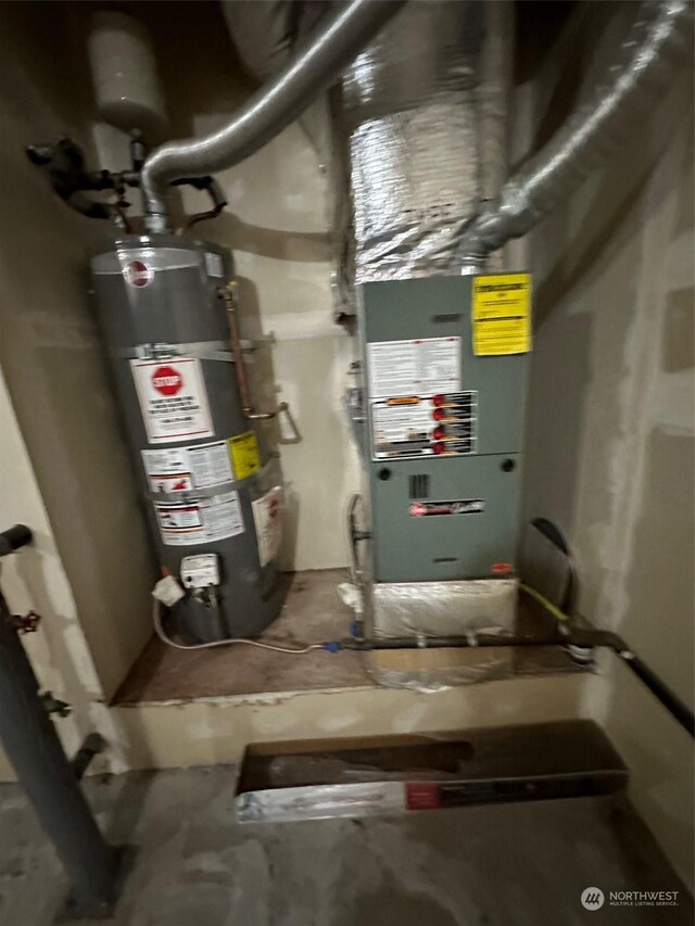 utility room with gas water heater