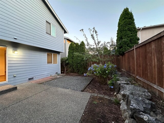 view of side of home featuring a patio