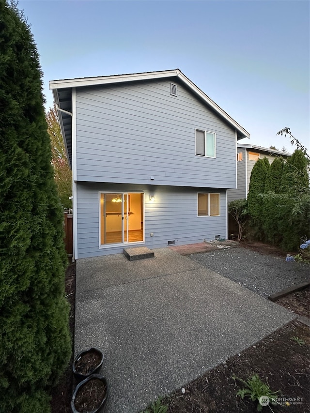 rear view of house featuring a patio