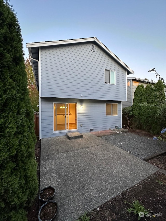 back of property featuring a patio