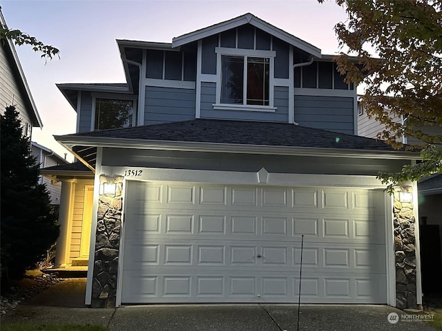 garage featuring driveway