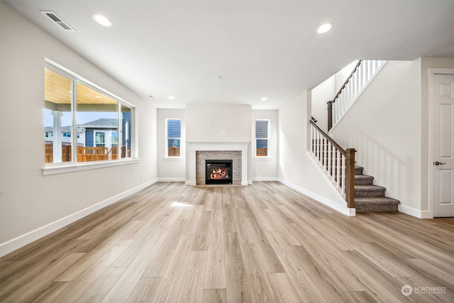 unfurnished living room featuring light hardwood / wood-style flooring