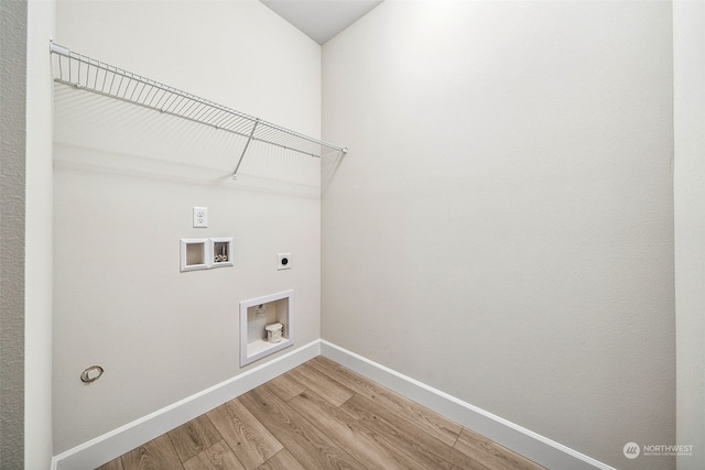 laundry area with hookup for a washing machine, hardwood / wood-style flooring, and electric dryer hookup