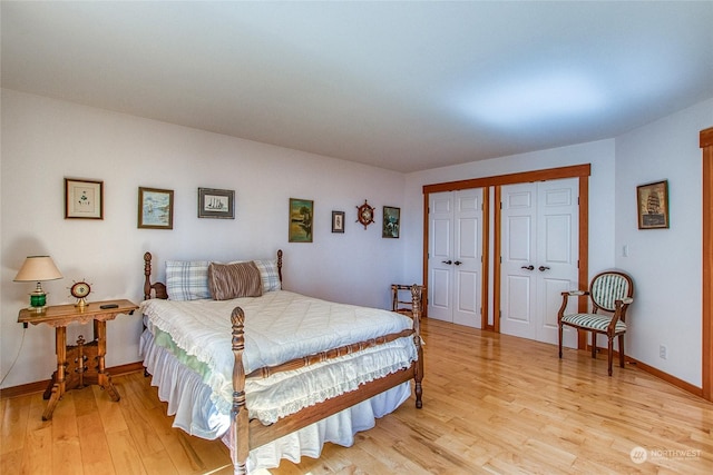 bedroom featuring light wood-style flooring and baseboards