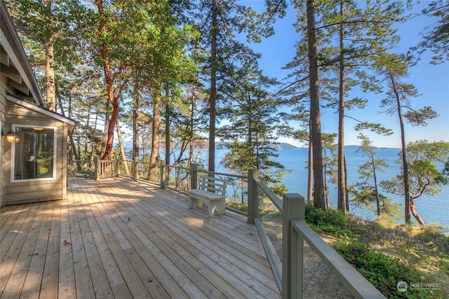 wooden deck featuring a water view
