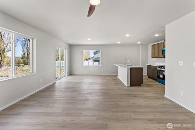 518 Chinook Winds Ln, Tieton, WA 98947 - unfurnished living room with light wood-type flooring, baseboards, a ceiling fan, and recessed lighting
