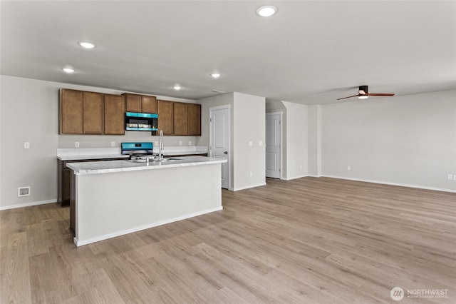 518 Chinook Winds Ln, Tieton, WA 98947 - kitchen featuring appliances with stainless steel finishes, recessed lighting, a sink, light countertops, and light wood-type flooring