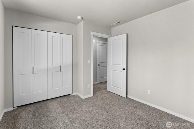 518 Chinook Winds Ln, Tieton, WA 98947 - unfurnished bedroom featuring a closet, visible vents, baseboards, and carpet floors