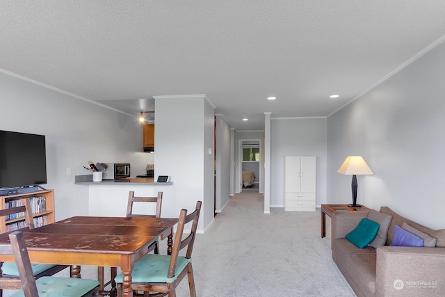 dining room with crown molding, light colored carpet, and a textured ceiling