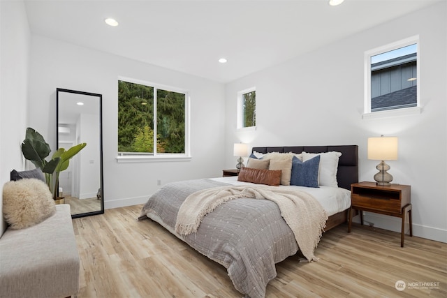 bedroom with light hardwood / wood-style floors