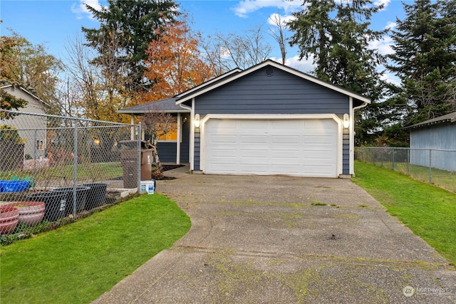 view of front of home featuring a front yard and a garage