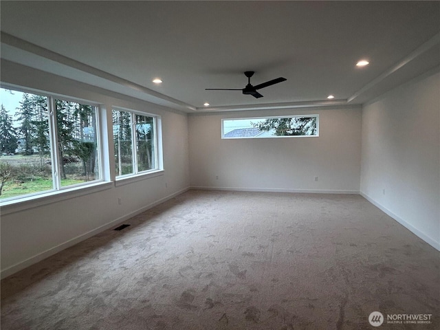 unfurnished room featuring visible vents, a ceiling fan, recessed lighting, carpet floors, and baseboards