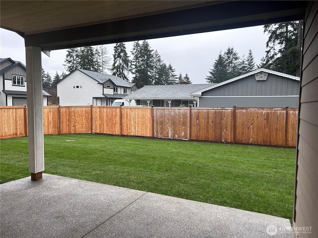 view of yard with a patio and fence