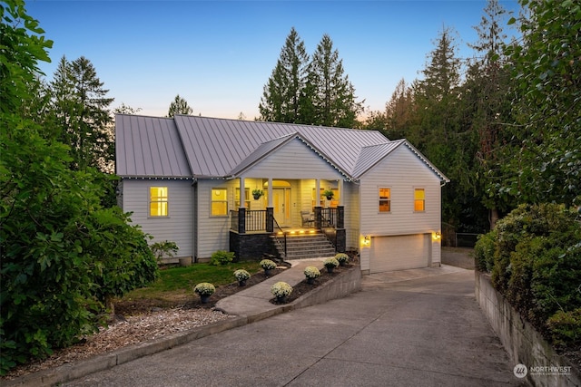 view of front of house with a garage and a porch