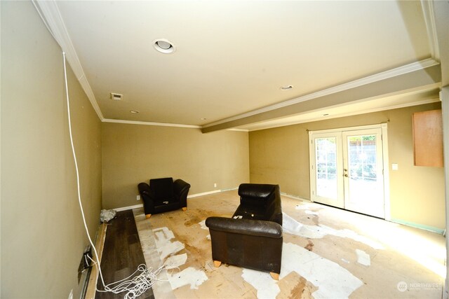 living area featuring french doors and crown molding