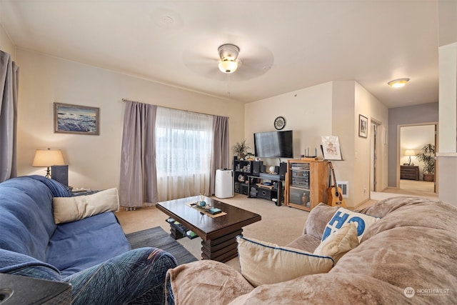 living room featuring light carpet and ceiling fan