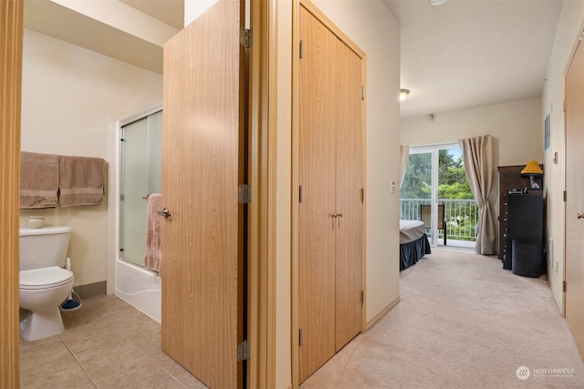 hall with light colored carpet