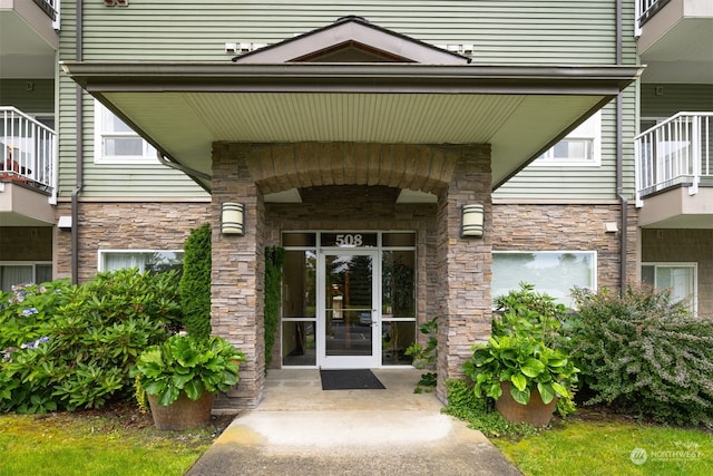 doorway to property featuring a balcony