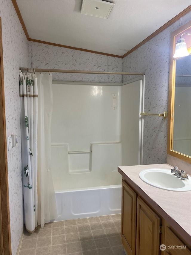 bathroom with ornamental molding, shower / tub combo, and vanity