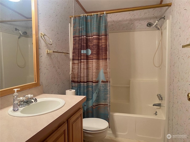 bathroom with shower / bath combo with shower curtain, vanity, toilet, and wallpapered walls