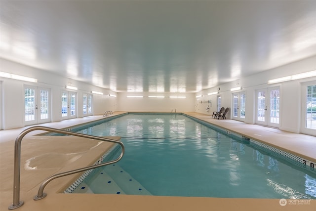 view of pool featuring french doors