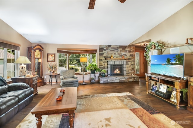 living room featuring ceiling fan, a fireplace, dark hardwood / wood-style flooring, and vaulted ceiling