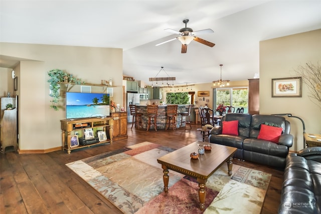 living room with ceiling fan with notable chandelier, lofted ceiling, and dark hardwood / wood-style floors