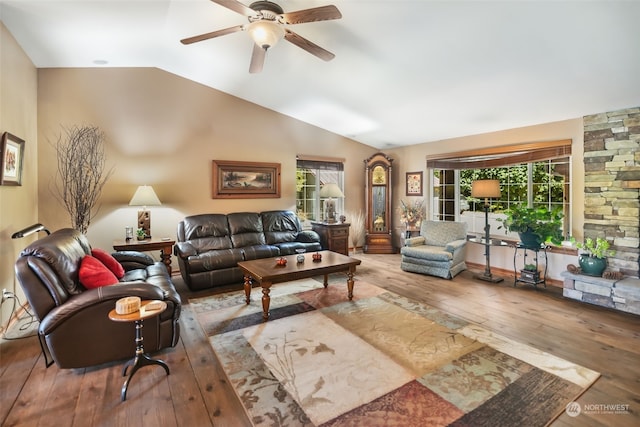 living room with vaulted ceiling, wood-type flooring, and ceiling fan